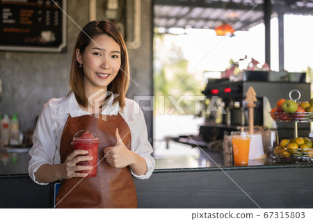Portrait of Asian female barista coffee shop owner at cafe Portrait of Asian female barista coffee shop owner at cafe 67315803