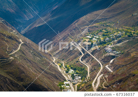 Beautiful mountain landscape view and winding road of Shangri-la country, Yunnan province, China 67316037