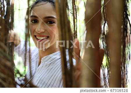 Young beautiful woman relaxation and working at park in summer holiday. Young beautiful woman relaxation and working at park in summer holiday. 67316528
