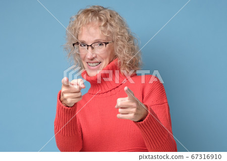 senior woman pointing you, saying you are great. senior woman pointing you, saying you are great. 67316910