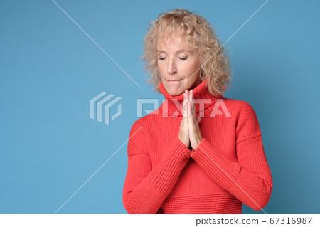 Portrait of a blond woman looking at copyspace, isolated on white background Portrait of a blond woman looking at copyspace, isolated on white background 67316987