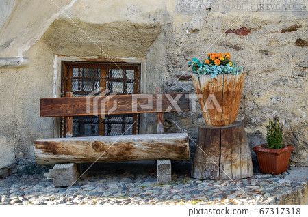 Wooden bench made of tree trunks - Engadin valley Switzerland 67317318
