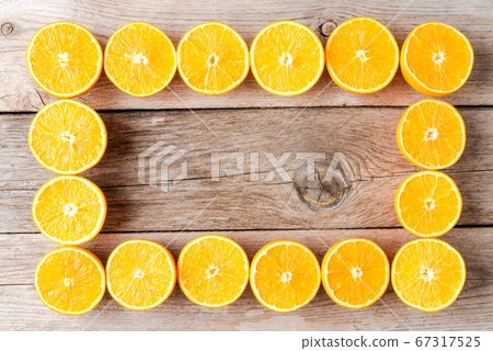 Orange halves on wooden table Orange halves on wooden table 67317525