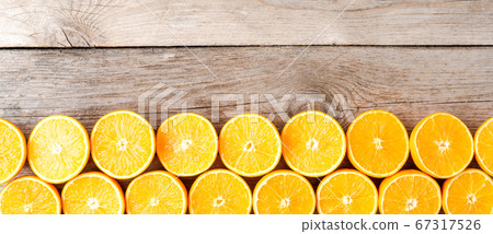 Juicy orange halves on wooden table. Top view Juicy orange halves on wooden table. Top view 67317526