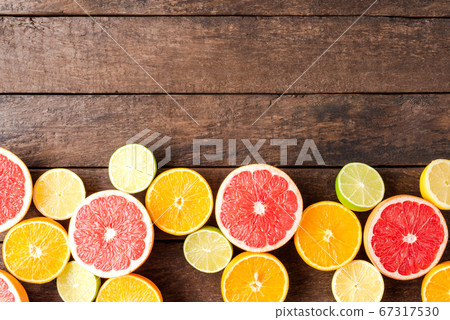 Juicy citruses on wooden table with copyspace Juicy citruses on wooden table with copyspace 67317530