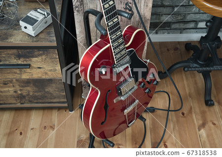 Red electric guitar full acoustic guitar 67318538