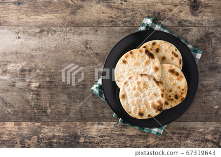 Handmade matzah for Jewish Passover on wooden table. Copy space Handmade matzah for Jewish Passover on wooden table. Copy space 67319643