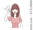 Smiling woman putting out ok sign 67319888