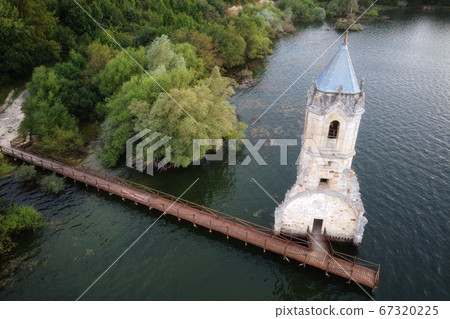 Aerial view of The fish cathedral. Sunken church ruins located in the Ebro reservoir in Cantabria Aerial view of The fish cathedral. Sunken church ruins located in the Ebro reservoir in Cantabria 67320225