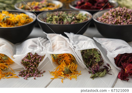 Filter tea bags filled with dry medicinal herbs 67321009