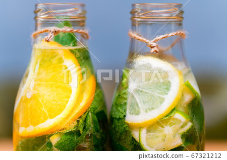 Homemade lemonade with fruit and mint. Closeup 67321212