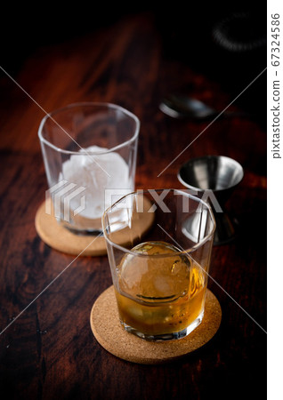 whiskey on the rock with perfect ice ball 67324586