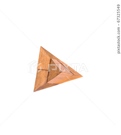 Top view. Wooden puzzle isolated on white background. Top view. Wooden puzzle isolated on white background. 67325549