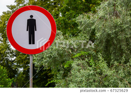 sign - No pedestrians sign - on a background of green trees 67325629