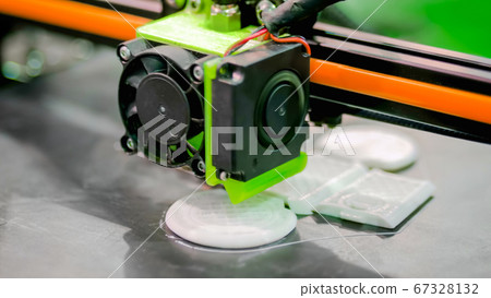 3D printer during work 67328132