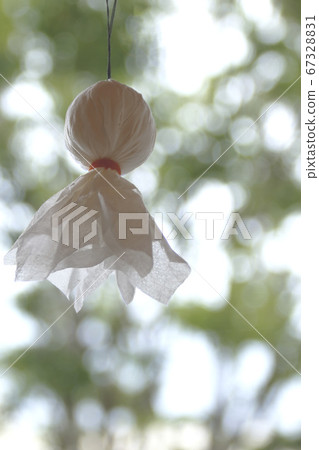 Teru Teru-bozu hanging on the window frame, Aori, back view Teru Teru-bozu hanging on the window frame, Aori, back view 67328831