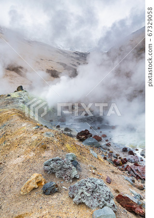 Mountain landscape, crater of active volcano: fumarole, hot spring, lava field, gas-steam activity. Dramatic volcanic landscape, travel destinations Mountain landscape, crater of active volcano: fumarole, hot spring, lava field, gas-steam activity. Dramatic volcanic landscape, travel destinations 67329058