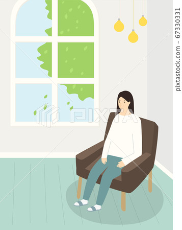 A woman sitting on the sofa A woman sitting on the sofa 67330331