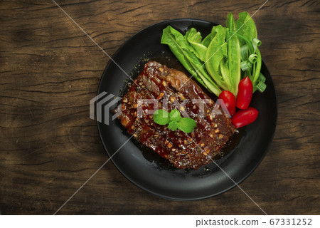 BBQ Pork Ribs with Sauce served Vegetable and 67331252