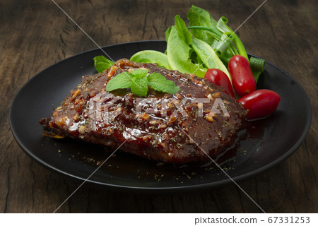 BBQ Pork Ribs with Sauce served Vegetable and 67331253