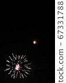 Moon and fireworks in the night sky 67331788