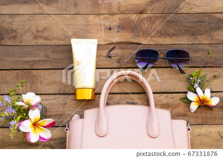 sunscreen spf50 cosmetics health care for skin face with pink hand bag sunglasses and flower frangipani sunscreen spf50 cosmetics health care for skin face with pink hand bag sunglasses and flower frangipani 67331876