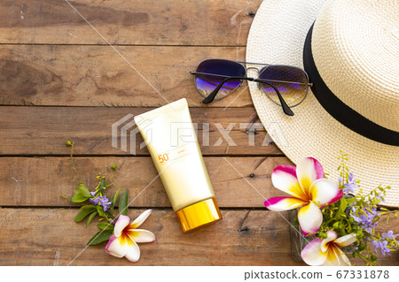 sunscreen spf50  cosmetics health care for skin face with hat ,sunglasses and  flower frangipani 67331878