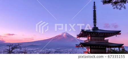 Fujiyoshida, Yamanashi, Japan - November 27, 2018: Mt Fuji at dawn with Chureito Pagoda. Top of the mountain gets morning sunlight. Designed for website banner. Fujiyoshida, Yamanashi, Japan - November 27, 2018: Mt Fuji at dawn with Chureito Pagoda. Top of the mountain gets morning sunlight. Designed for website banner. 67335155