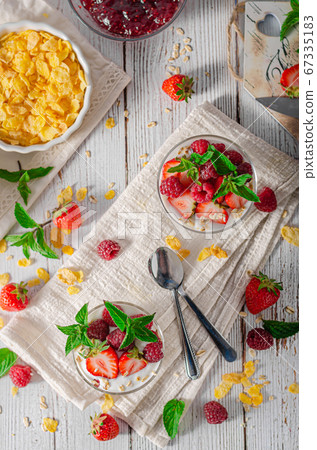 Granola yogurt fruits 67335183