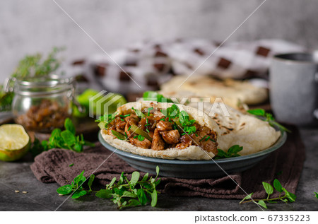 Homemade pita bread with meat and herbs 67335223