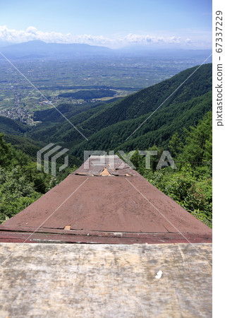 Azumino City, Nagano Prefecture with a view of Azumino from the paraglider launcher stand (takeoff platform) near the Misato Skyline Observatory Azumino City, Nagano Prefecture with a view of Azumino from the paraglider launcher stand (takeoff platform) near the Misato Skyline Observatory 67337229