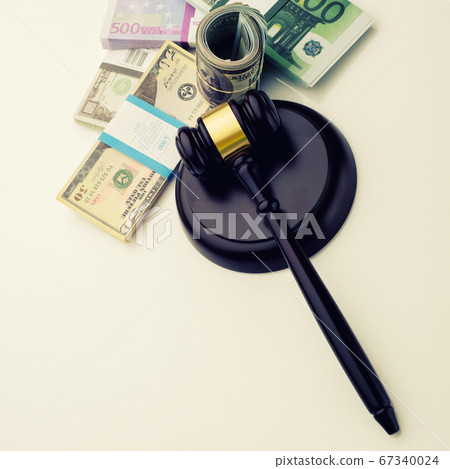 Top view Judge's gavel and packs of dollars and Top view Judge's gavel and packs of dollars and 67340024