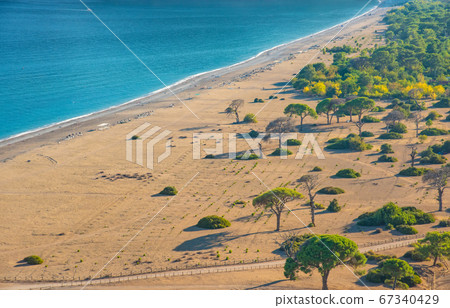 Aerial view of Cirali Beach from ancient Olympos ruins, Antalya Turkey 67340429