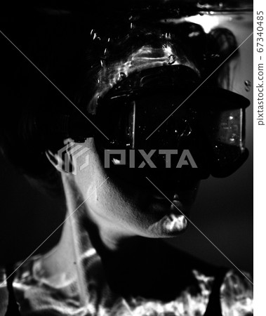 closeup view of beautiful woman in pool water wearing swimming mask closeup view of beautiful woman in pool water wearing swimming mask 67340485