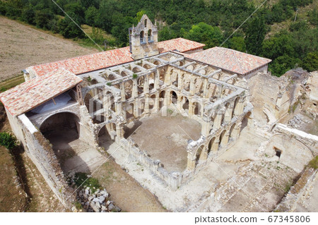 Aerial view of the Ruins Of An Ancient Abandoned Monastery In Santa Maria De Rioseco, Burgos, Spain. Aerial view of the Ruins Of An Ancient Abandoned Monastery In Santa Maria De Rioseco, Burgos, Spain. 67345806