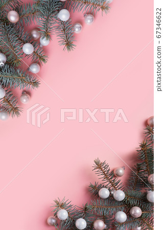 Christmas white balls and fir branches on pink. Christmas white balls and fir branches on pink. 67346622