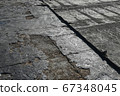 Bitumen flat roofing renovation, background texture of removed damaged insulation layer of roof 67348045