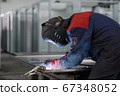 Welder working on factory, Welding Work. Erecting Technical Steel Industrial Craftsman on plant. 67348052
