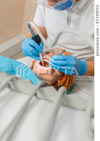The patient visits the dentist regarding the The patient visits the dentist regarding the 67348055