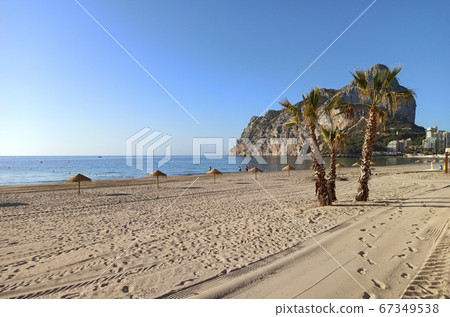 Empty beach Ifach mountain view 67349538