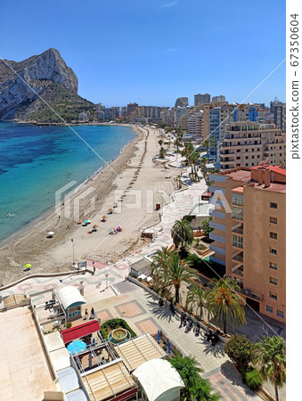 Sandy beach, Ifach natural park view. Calpe 67350604