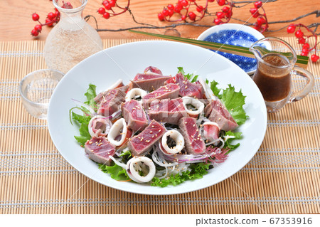 Broiled tuna lean and boiled squid radish seaweed salad. Serve with soy sauce dressing. Broiled tuna lean and boiled squid radish seaweed salad. Serve with soy sauce dressing. 67353916