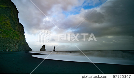 The cliffs by the township of Vik in Iceland The cliffs by the township of Vik in Iceland 67355347