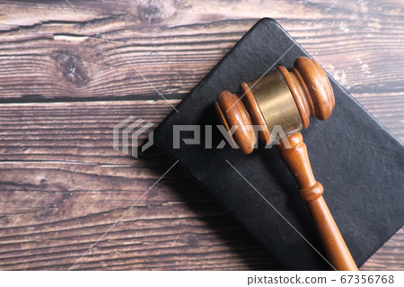 Top view of gavel on a book on table  67356768