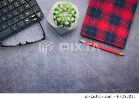 high angle view of eyeglass, notepad and keyboard with copy space high angle view of eyeglass, notepad and keyboard with copy space 67356835