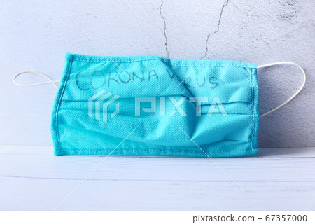 Surgical masks with rubber ear straps drop on gray background  67357000