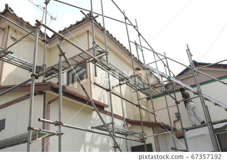 Scaffolding assembly by home renovation work Scaffolding assembly by home renovation work 67357192