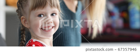 Mom teaches daughter to play electronic piano Mom teaches daughter to play electronic piano 67357946