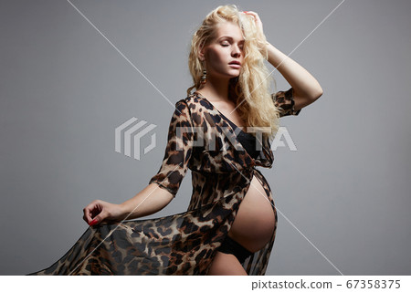 young beautiful pregnant woman. Blonde girl with young beautiful pregnant woman. Blonde girl with 67358375