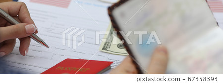 Woman fills out visa application form in usa Woman fills out visa application form in usa 67358393